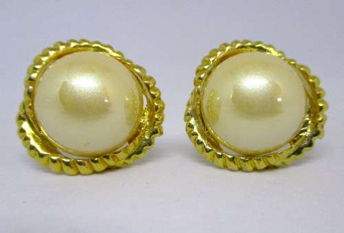Lovely pair of Vintage Clip on Earrings. Large Faux Marbe set in gold color ribbon.