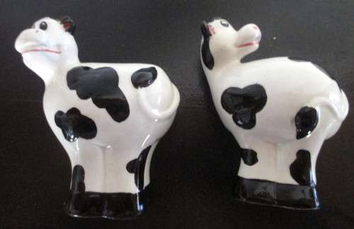Salt and Pepper Shakers. Cow themed.  Spotless.