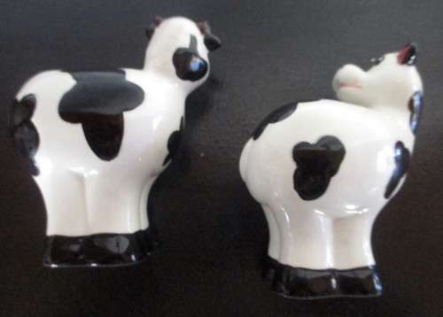 Salt and Pepper Shakers. Cow themed.  Spotless.