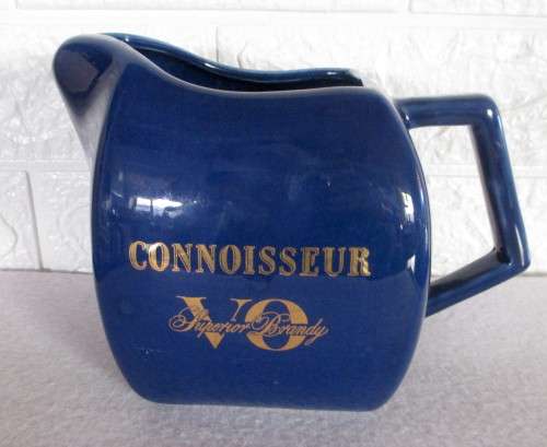 Vintage Dark Blue `Connoisseur V.O Superior Brandy` ceramic water jug with an ice lip. 130mm high.