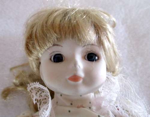 Vintage Soft Body Porcelain Doll. Very Beautiful with Original Clothes. Ons Stand.300mm high.