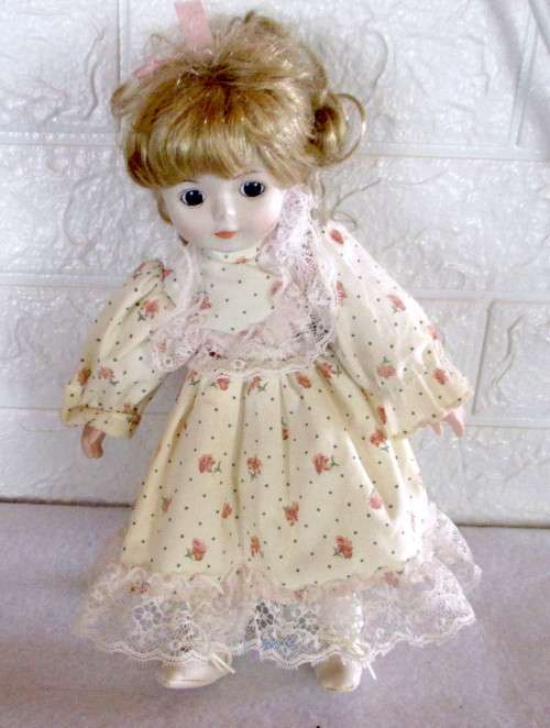 Vintage Soft Body Porcelain Doll. Very Beautiful with Original Clothes. Ons Stand.300mm high.