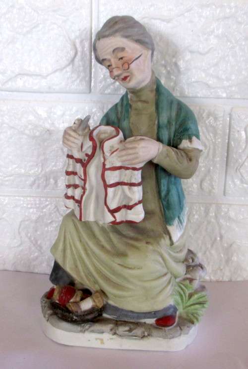 Lovely Vintage Unglazed Porcelain Figurine. Old Lady mending clothes. Taiwan. Spotless, 210mm high.