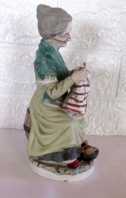 Lovely Vintage Unglazed Porcelain Figurine. Old Lady mending clothes. Taiwan. Spotless, 210mm high.
