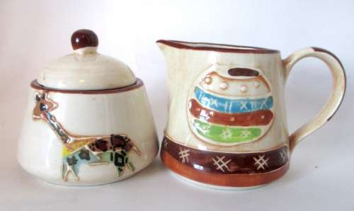 Handmade Ceranic Africa themed milk jug and sugar pot.
