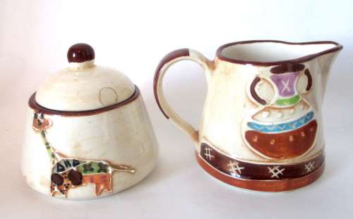 Handmade Ceranic Africa themed milk jug and sugar pot.