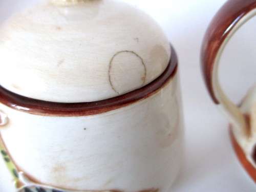 Handmade Ceranic Africa themed milk jug and sugar pot.