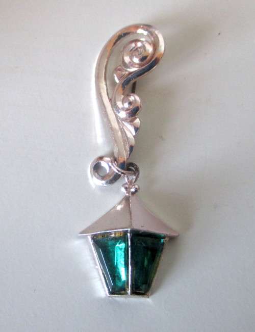 Vintage Street lamp Brooch hanging from elaborate silver toned embellishment. Never seen before.