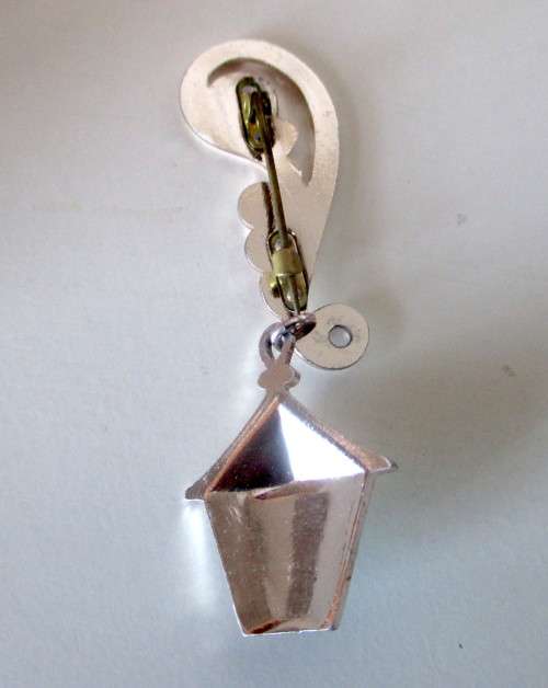 Vintage Street lamp Brooch hanging from elaborate silver toned embellishment. Never seen before.