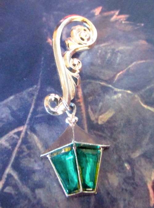 Vintage Street lamp Brooch hanging from elaborate silver toned embellishment. Never seen before.