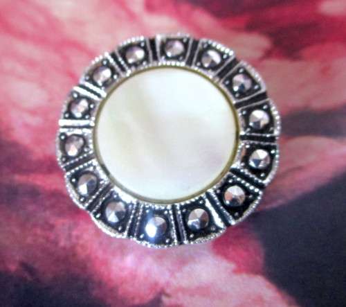 Vintage Stylish Scarf Clip. Mother of Pearl in a Marcasite and ornate silver color setting. 30mm dia