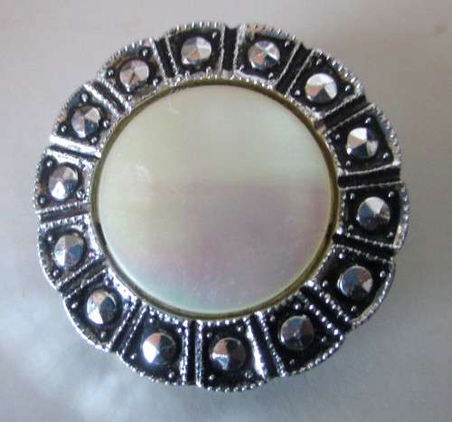 Vintage Stylish Scarf Clip. Mother of Pearl in a Marcasite and ornate silver color setting. 30mm dia