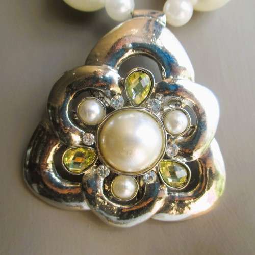Costume Jewelry. Faux pear bead and silver color necklace with large ornate pendant. 44cm