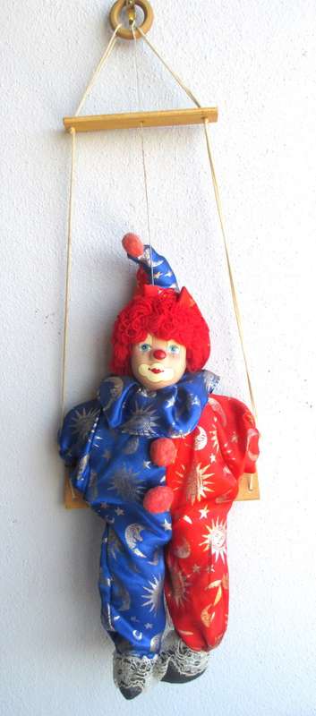 Vintage Hanging Porcelain Face Clown Doll with Red Hair, on a swing. Doll 400mm long