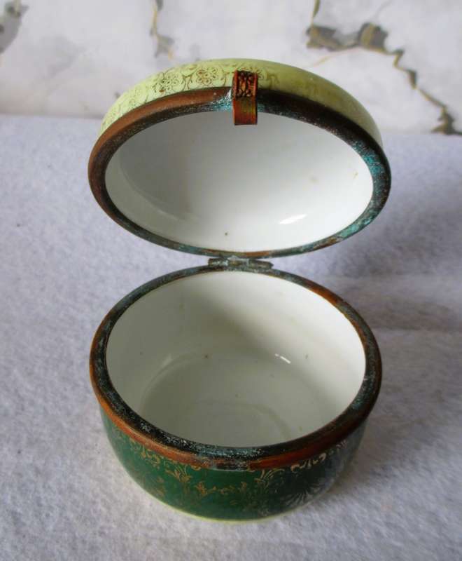 German Porcelain Round Trinket Box with hand painted gilt, brass hinge and rim. Pastoral Scene.