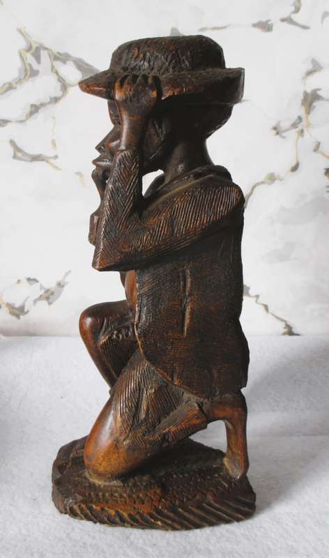 Very nice Dark wood carved old  African man smoking his pipe. 28cm high. Marked Harold.