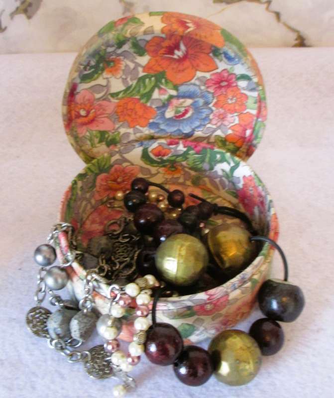 Vintage Valeur round Powder container, covered with material, contains some vintage jewelry.