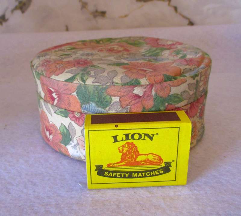 Vintage Valeur round Powder container, covered with material, contains some vintage jewelry.