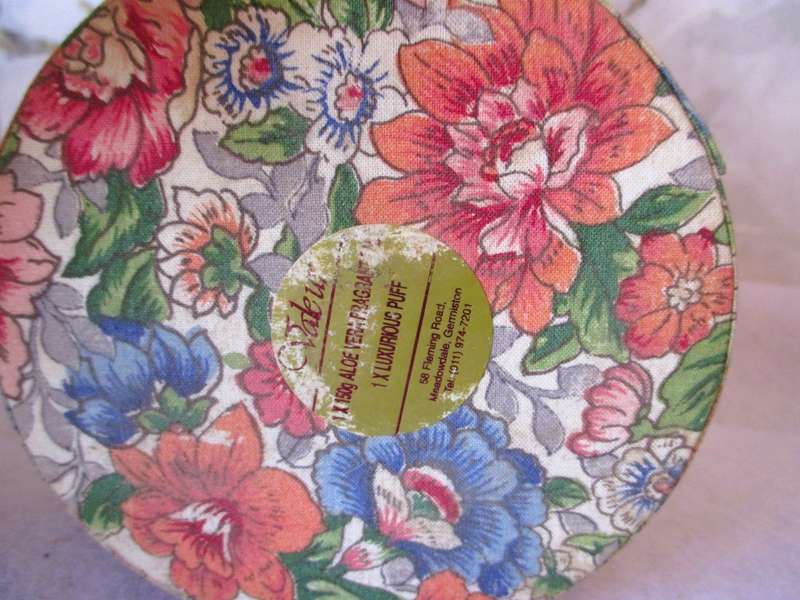 Vintage Valeur round Powder container, covered with material, contains some vintage jewelry.