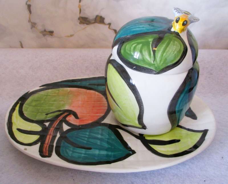 Hand made and painted honey pot with plate. Marked Glaudine. Please note chip and repaired crack.