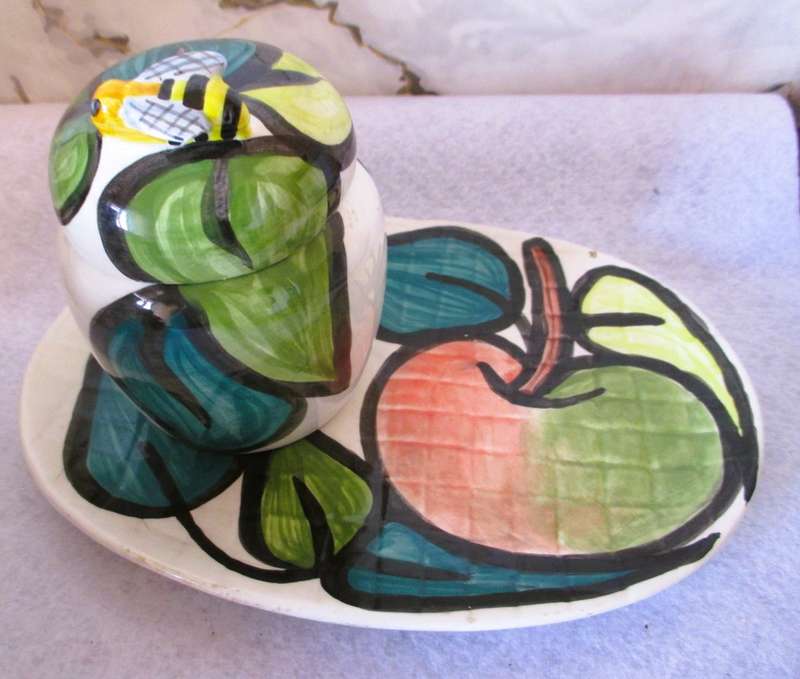 Hand made and painted honey pot with plate. Marked Glaudine. Please note chip and repaired crack.