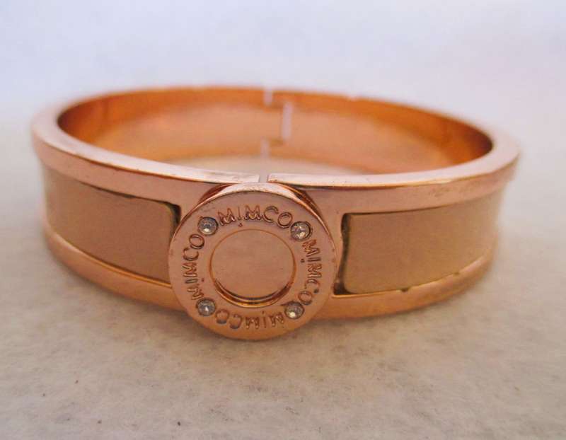 Designers Mimco Rose Gold Solid Hinged Bangle. Brass with a rose gold coloured plating and leather.