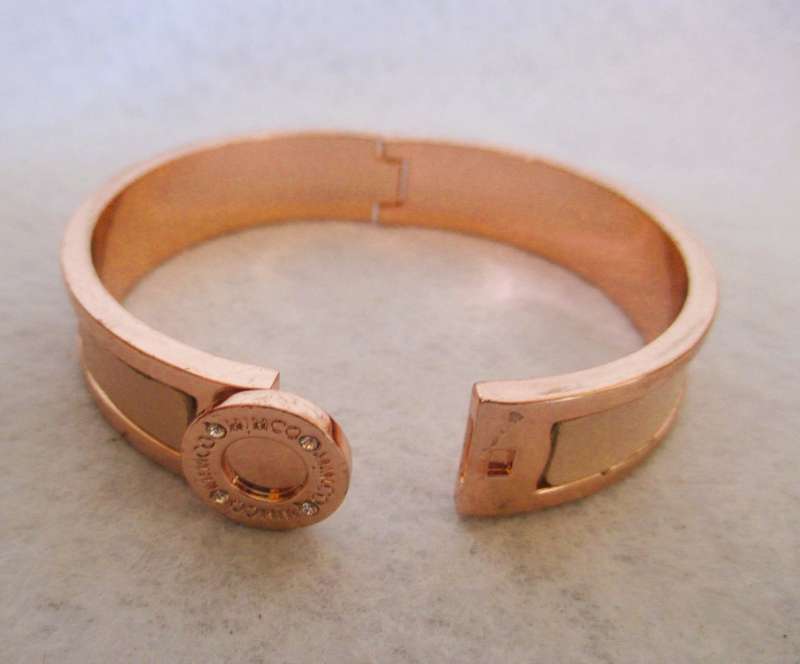 Designers Mimco Rose Gold Solid Hinged Bangle. Brass with a rose gold coloured plating and leather.