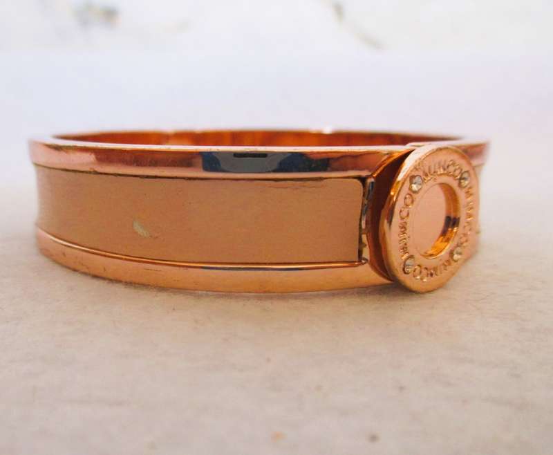 Designers Mimco Rose Gold Solid Hinged Bangle. Brass with a rose gold coloured plating and leather.