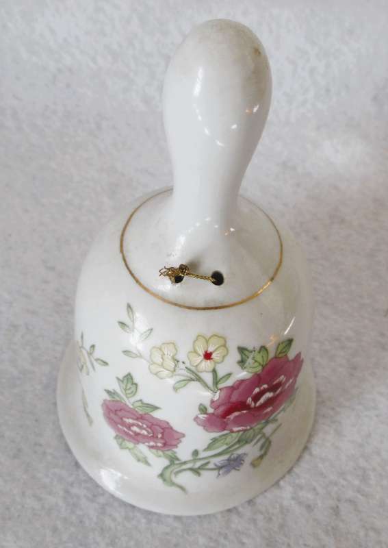 Lovely Vintage Porcelain Bell hand painted with roses. No chips or craks.