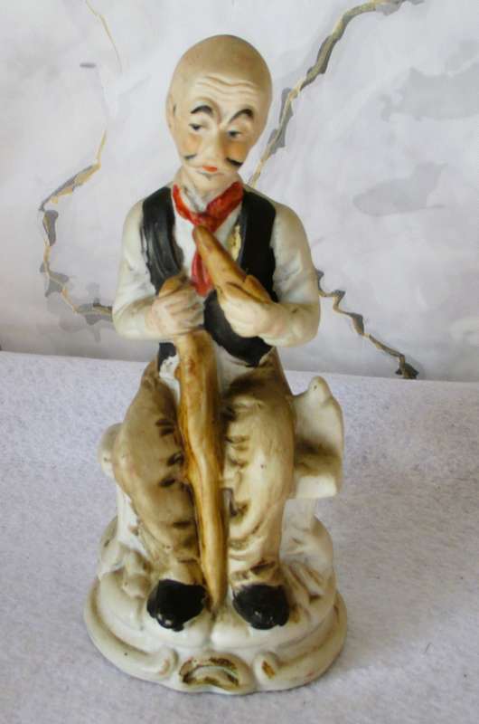 Vintage Bisque Porcelain Old Man Sitting on Bench with Cane/Pipe. 165mm hgh.