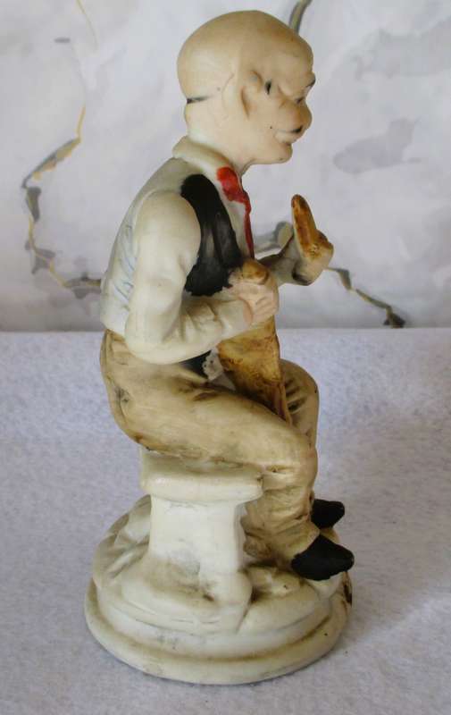 Vintage Bisque Porcelain Old Man Sitting on Bench with Cane/Pipe. 165mm hgh.