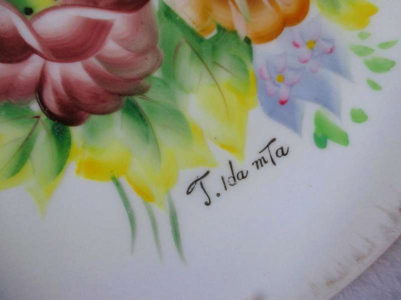 Vintage Porcelain hand painted Lamode wall hanging plate, with wire hanger.  circa 1960. 26cm dia.