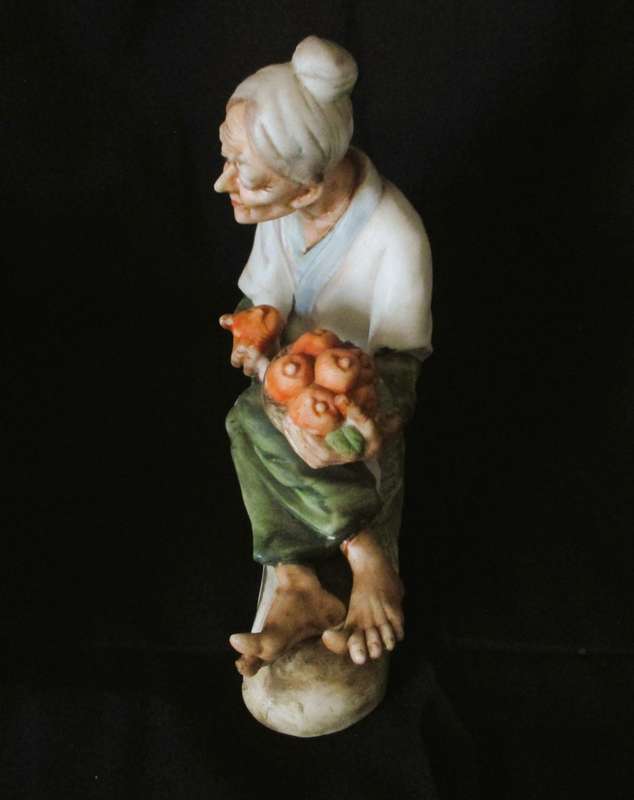 Vintage Ceramic Figurine, old lady with oranges in basket. Lovely item. 160x160mm