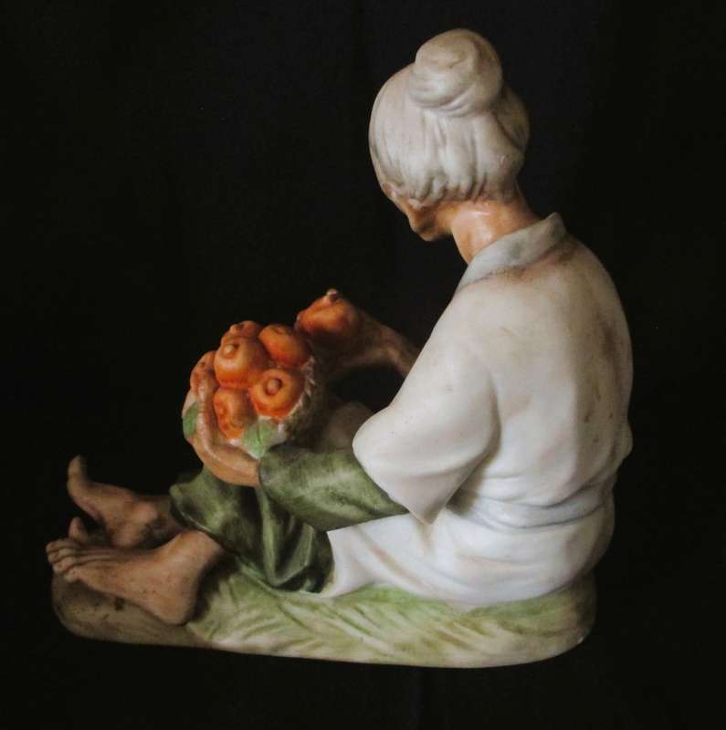 Vintage Ceramic Figurine, old lady with oranges in basket. Lovely item. 160x160mm