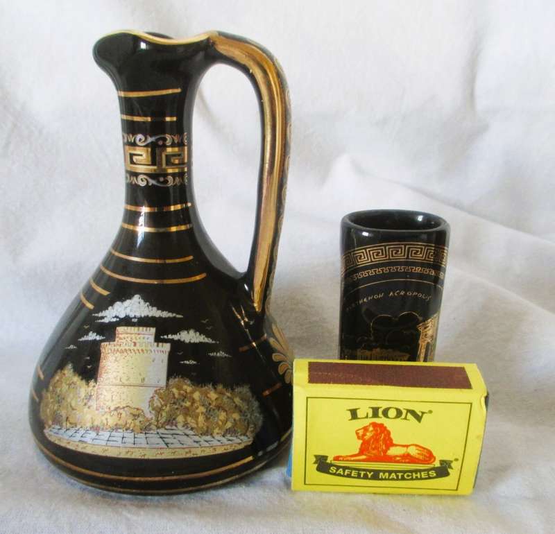 Two Strigosand Mantigos  Greek 24k Gold decorated Black Vases Pitchers. 130mm high.