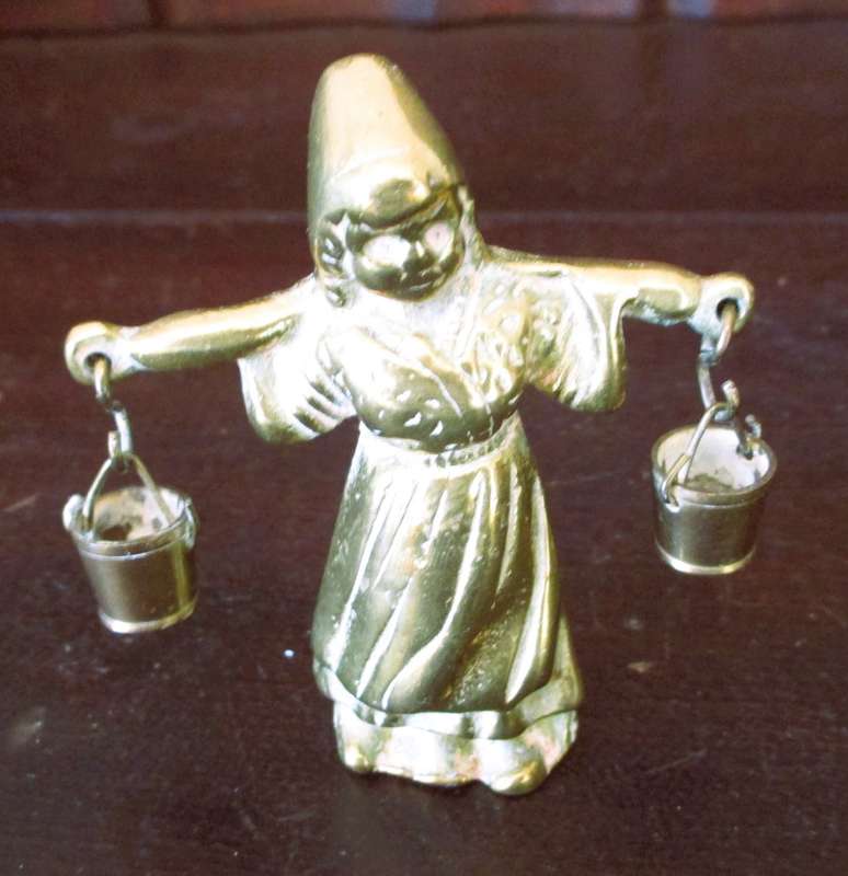 Antique brass figurine girl carrying two milk baskets. Marked.