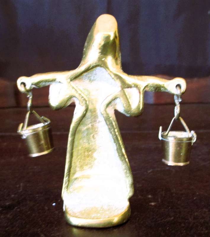 Antique brass figurine girl carrying two milk baskets. Marked.