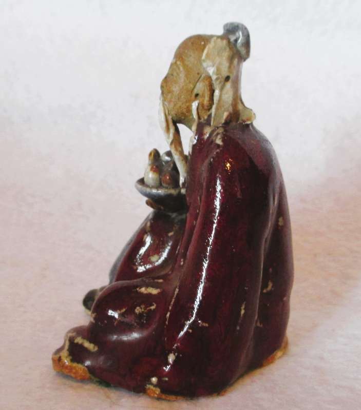 Vintage Chinese flambé glazed pottery figure,  early 20th century. Lots of caracter. 80mm high.