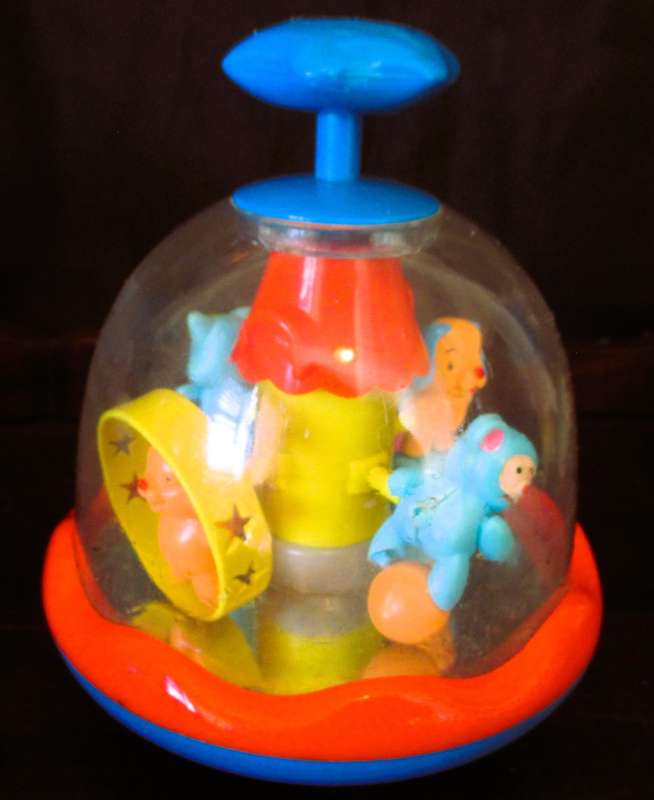 VINTAGE PUSH`N MERRY-GO-ROUND KIDS TOY CAROUSEL, WORKING. 170MM HIGH.