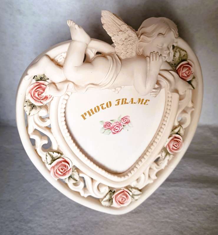 Heart shape porcelain jewelry box and photo frame with cherub baby.