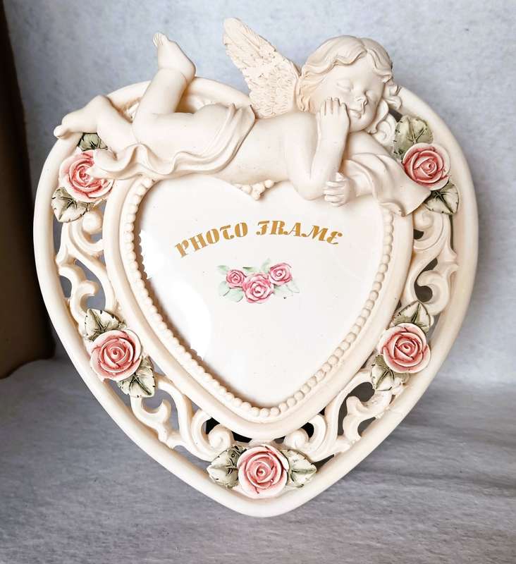 Heart shape porcelain jewelry box and photo frame with cherub baby.