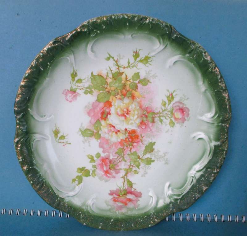 Two Antique green and pink floral plates Unmarkd. Lovely. 230mm diameter.