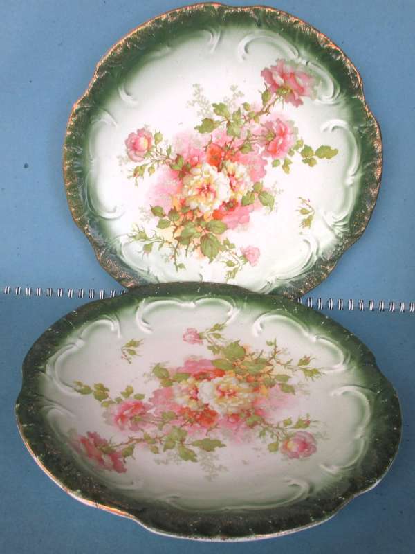 Two Antique green and pink floral plates Unmarkd. Lovely. 230mm diameter.