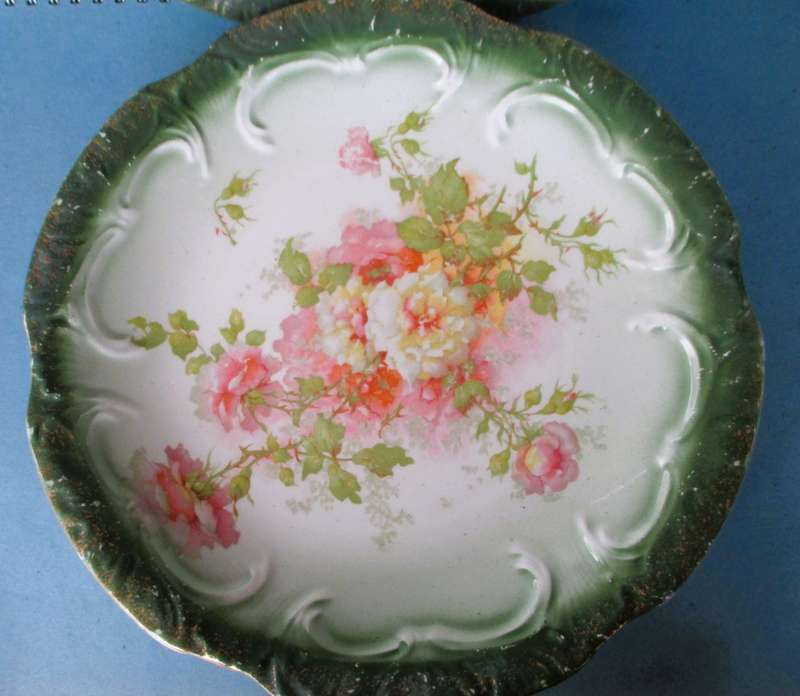 Two Antique green and pink floral plates Unmarkd. Lovely. 230mm diameter.