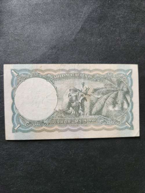 Ceylon One Rupee 1942 King George VI  (nice condition) - as per photograph