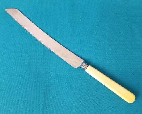 VINTAGE BONE HANDLE BREAD KNIFE (SHEFFIELD, ENGLAND)
