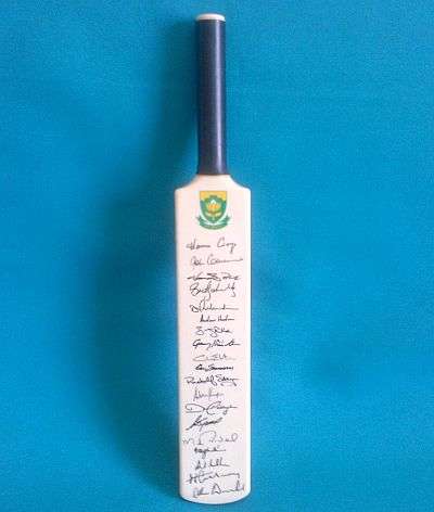 S.A. MINIATURE CRICKET BAT WITH 19 SIGNATURES (HANSIE CRONJE ETC.)