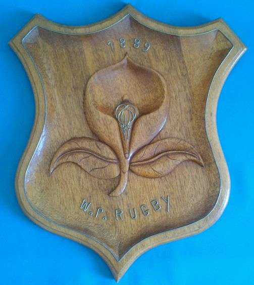 NICE LARGE W.P. RUGBY 1889 WOODEN WALL PLAQUE