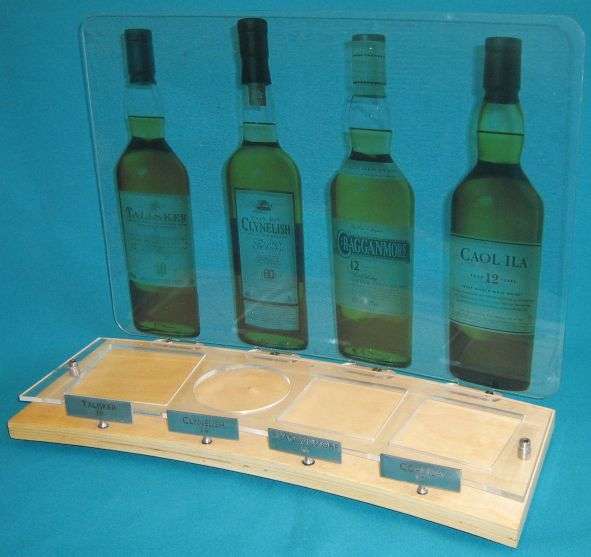 NICE 4 BOTTLE WHISKY STAND (TALISKER, CLYNELISH ETC.)