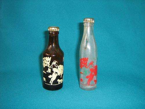 2 OLD MINIATURE COWBOY GLASS GINGER BEER BOTTLES